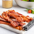 fried bacon on a cutting board