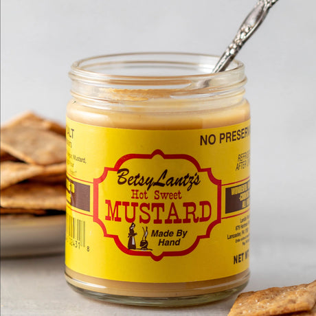 an open jar of hot sweet mustard