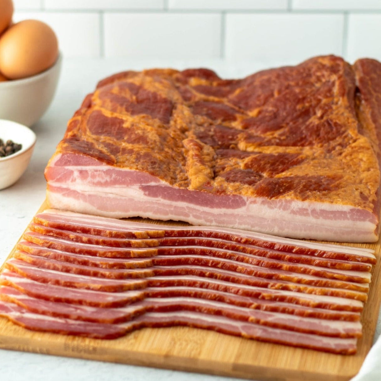 sliced bacon on a cutting board