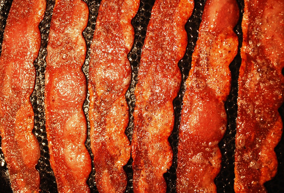 turkey bacon frying in pan