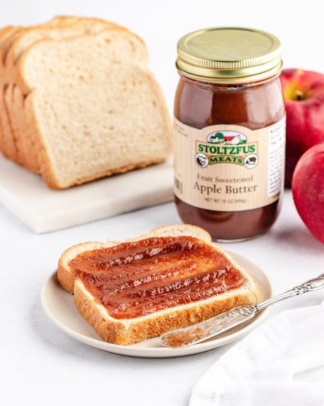 Apple butter spread upon a piece of bread
