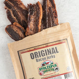 an opened pack of bacon jerky