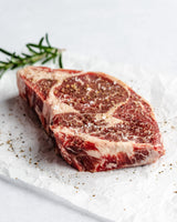 a seasoned ribeye steak