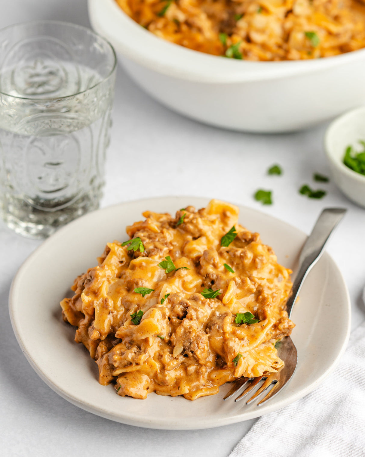 a cheese and ground beef casserole on a plate