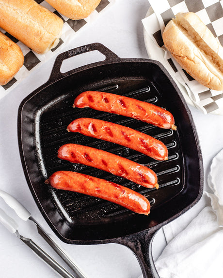 smoked sausages in a frying pan