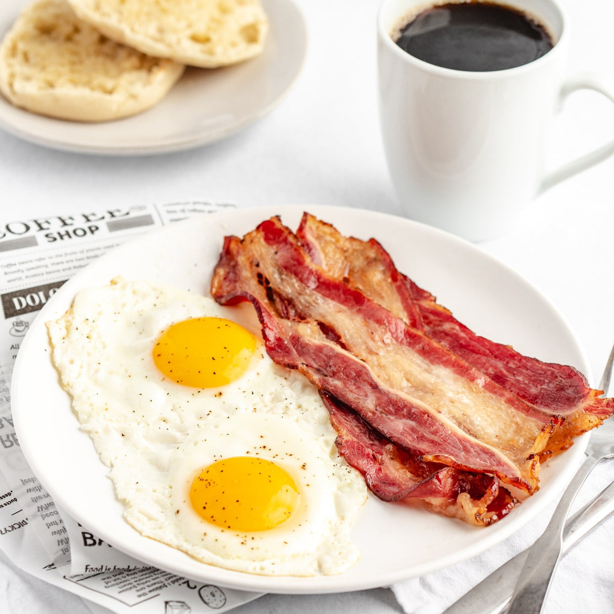 beef bacon with eggs on a plate