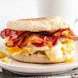 a breakfast sandwich with beef bacon