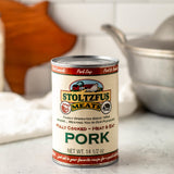 a can of canned pork on a kitchen counter
