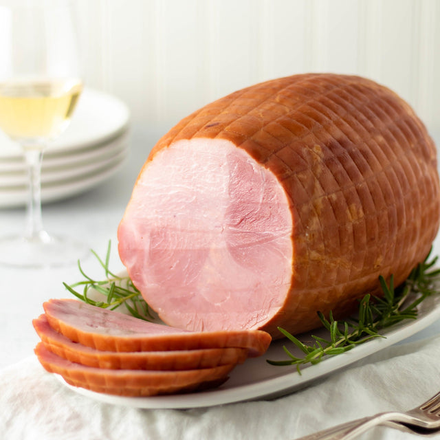 a carved boneless smoked ham